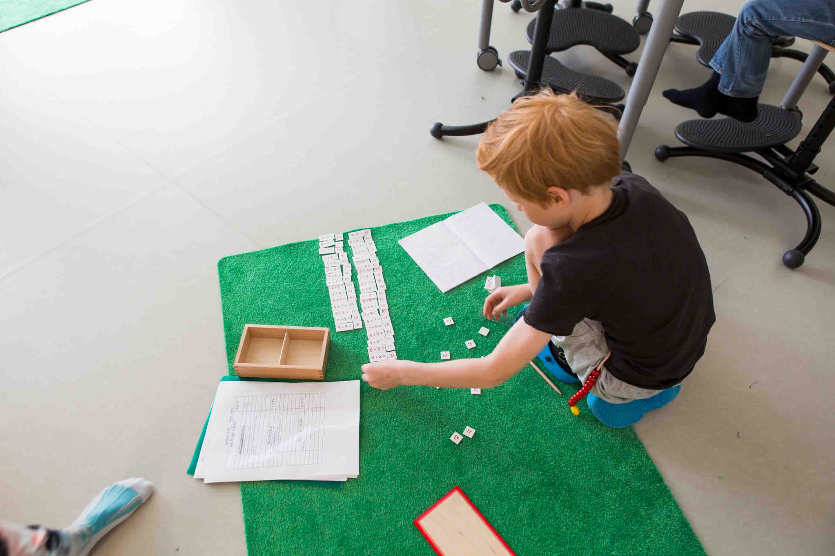 A primary school student doing assignments.